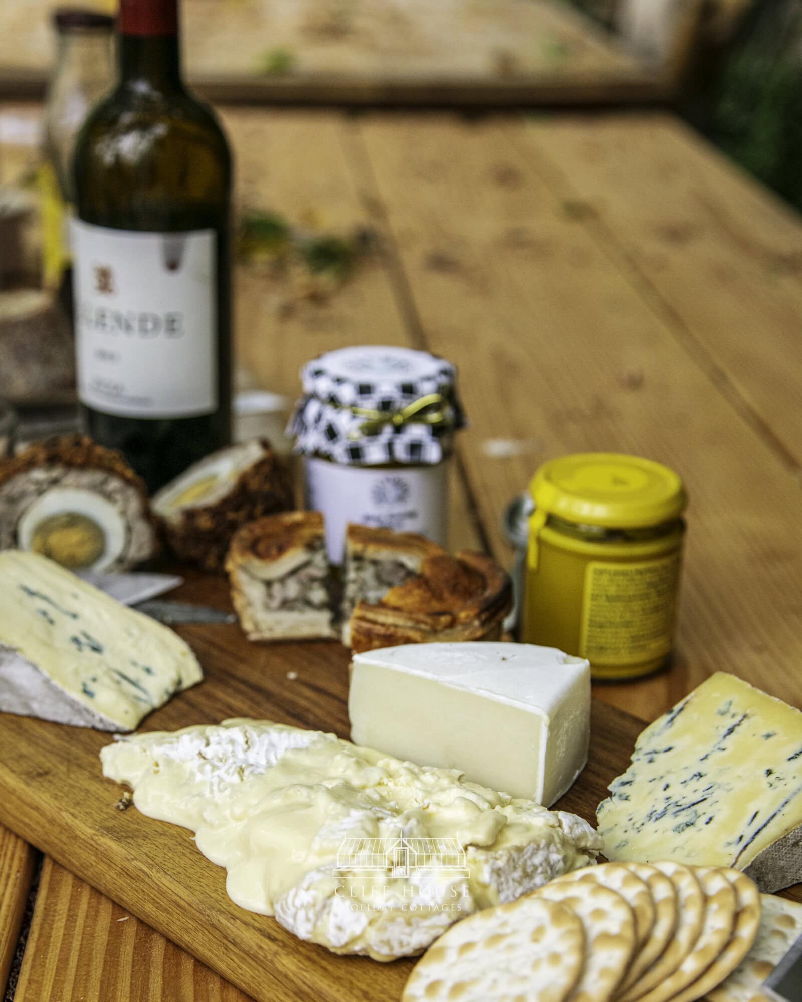 cliff house holiday cottages a selection of locally sourced food including scotch eggs pork pies and yorkshire cheese served on a handcrafted wooden board in the orangery at cliff house holiday cottages overlooking the gardens in north yorkshire